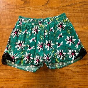 Green floral shorts with black lace trim